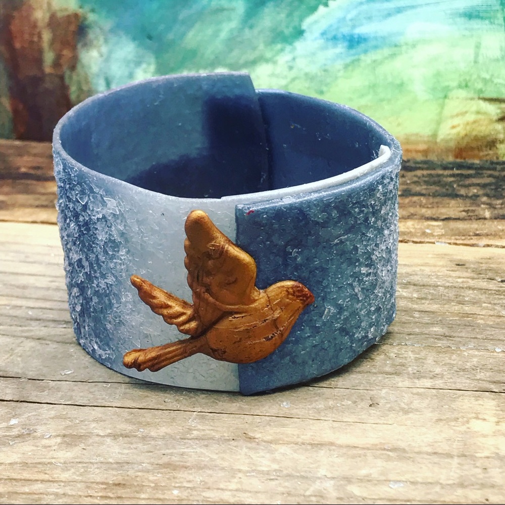 Matana chasing a feather Bird bangle in Denim - Picture 3 of 8